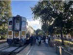 Several people board Amtrak Train # 547 at Davis, many of which are college students who attend UC Davis.